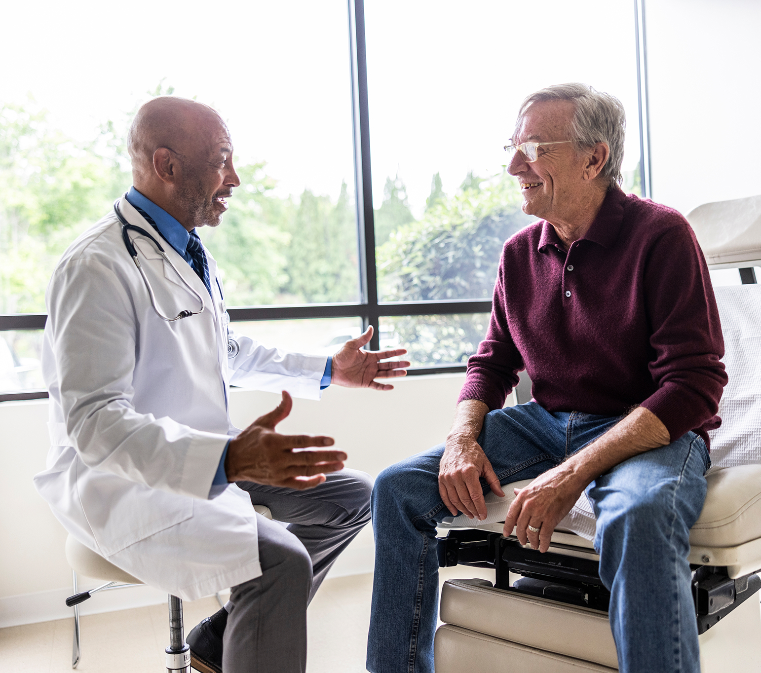 A man talking to a doctor about dialysis access managment